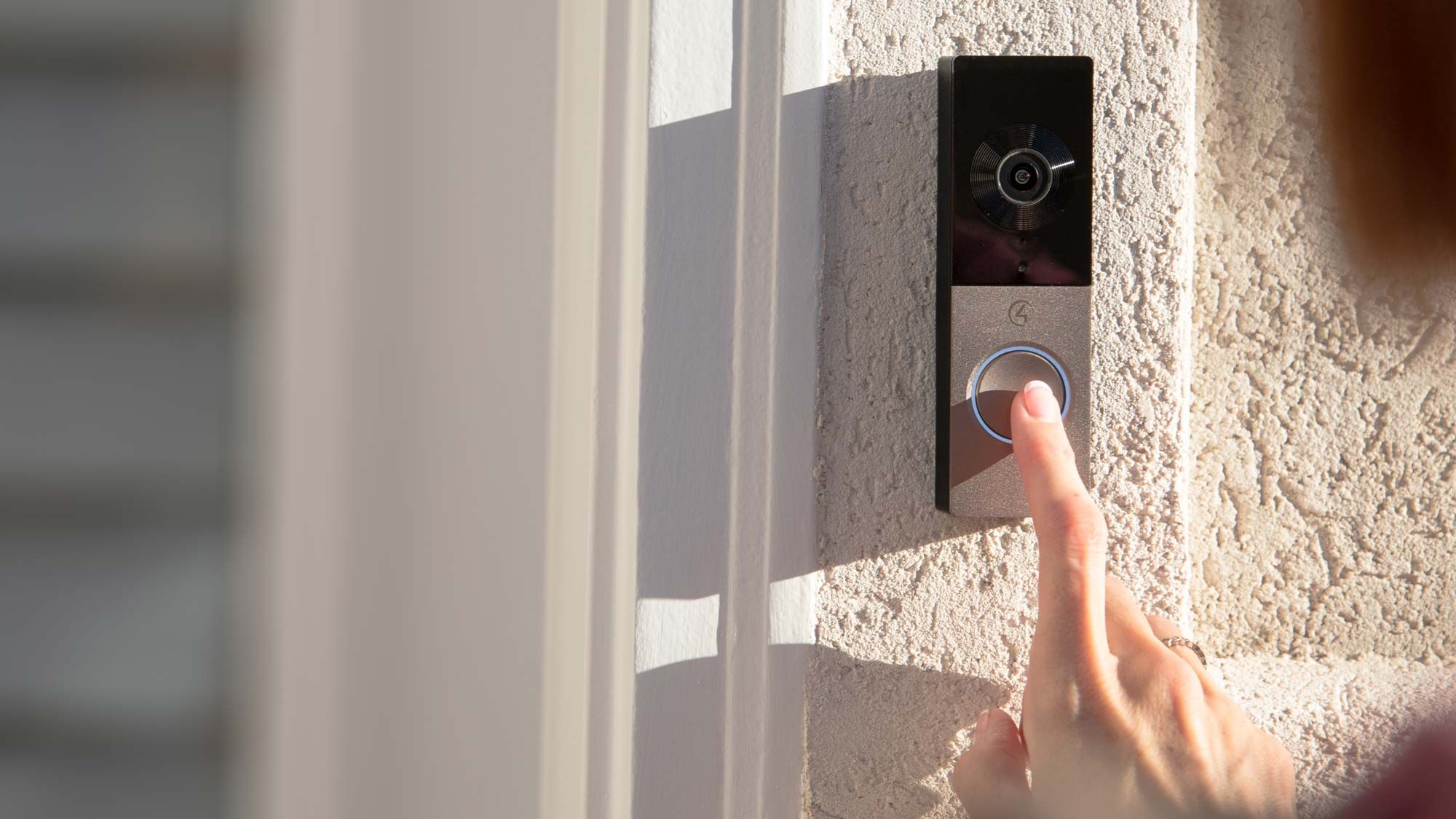 woman pressing chime doorbell from Control4